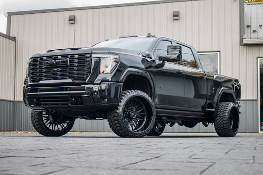 2024 GMC Sierra 3500 Denali Ultimate with a 3" Cognito leveling kit, 24x14 American Force Frost wheels, and 33" Fury Country Hunter M/T tires.