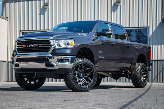 2021 Ram 1500 Lone Star with a 6" Rough Country lift kit, 22x12 Fuel Twitch wheels, and 35" Fury Country Hunter R/T tires.