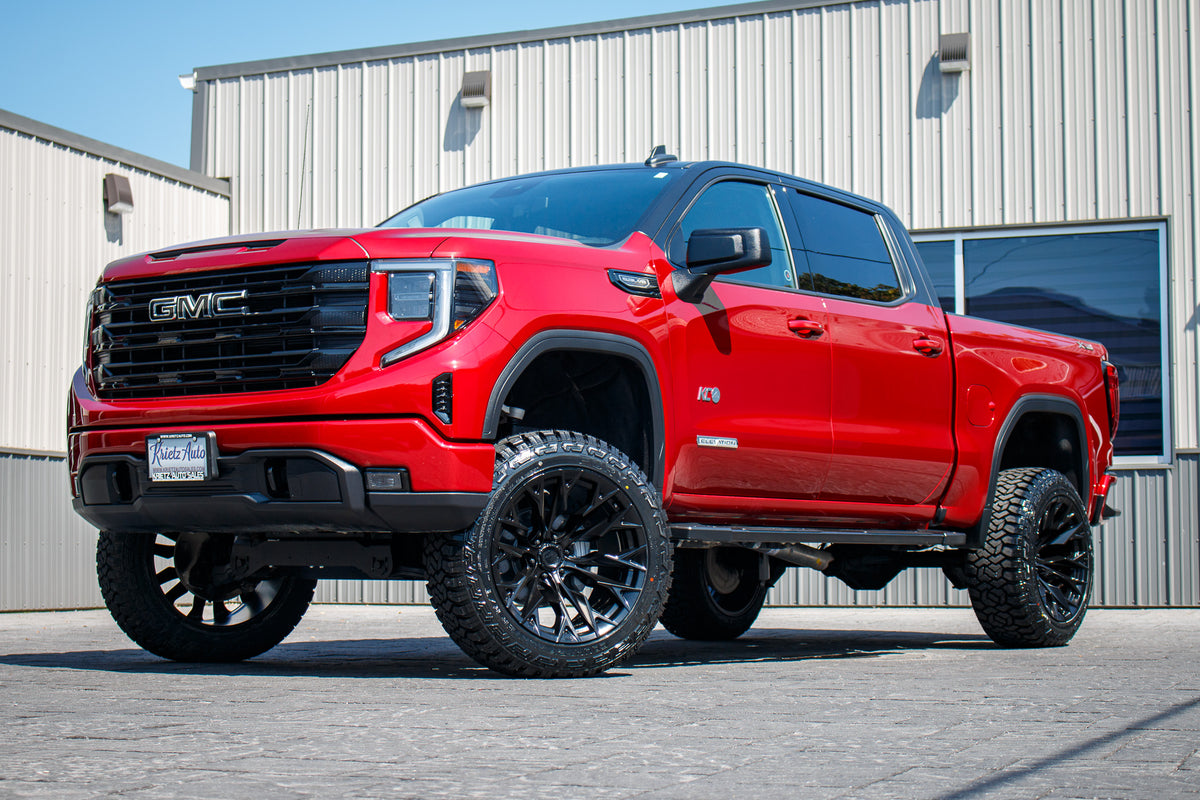 2023 GMC Sierra 1500 Elevation with a 6" Rough Country lift kit, 22x12 Fuel Flame wheels, and Fury Country Hunter R/T tires.