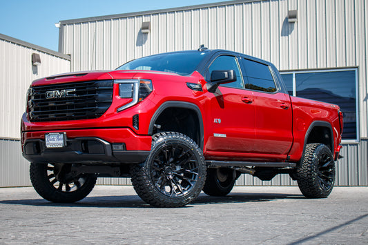2023 GMC Sierra 1500 Elevation with a 6" Rough Country lift kit, 22x12 Fuel Flame wheels, and Fury Country Hunter R/T tires.