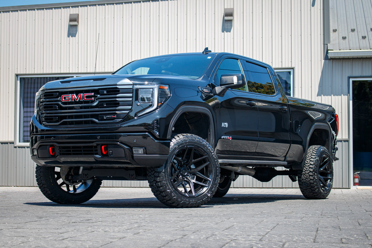 2024 GMC Sierra 1500 AT4 with a 6" Rough Country lift kit, 22x12 Fuel Flux wheels, and 35" Fury Country Hunter R/T tires.