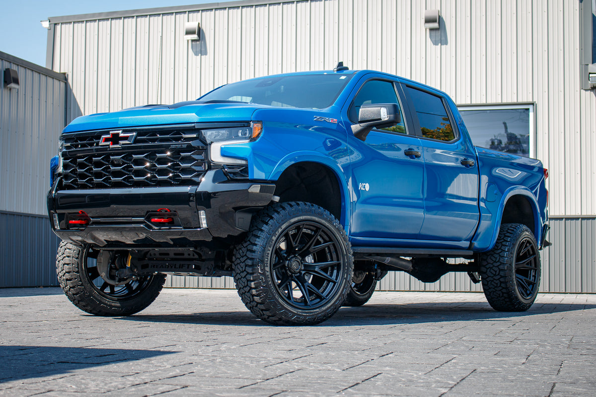 2023 Chevrolet Silverado 1500 ZR2 with a 4" Readylift lift kit, 22x12 Fuel Catalyst wheels, and 35" Fury Country Hunter R/T tires.