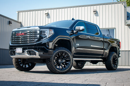 2023 GMC Sierra 1500 Denali with a 6" Rough Country lift kit, 22x12 Fuel Flame wheels, and 35" Fury Country Hunter R/T tires.