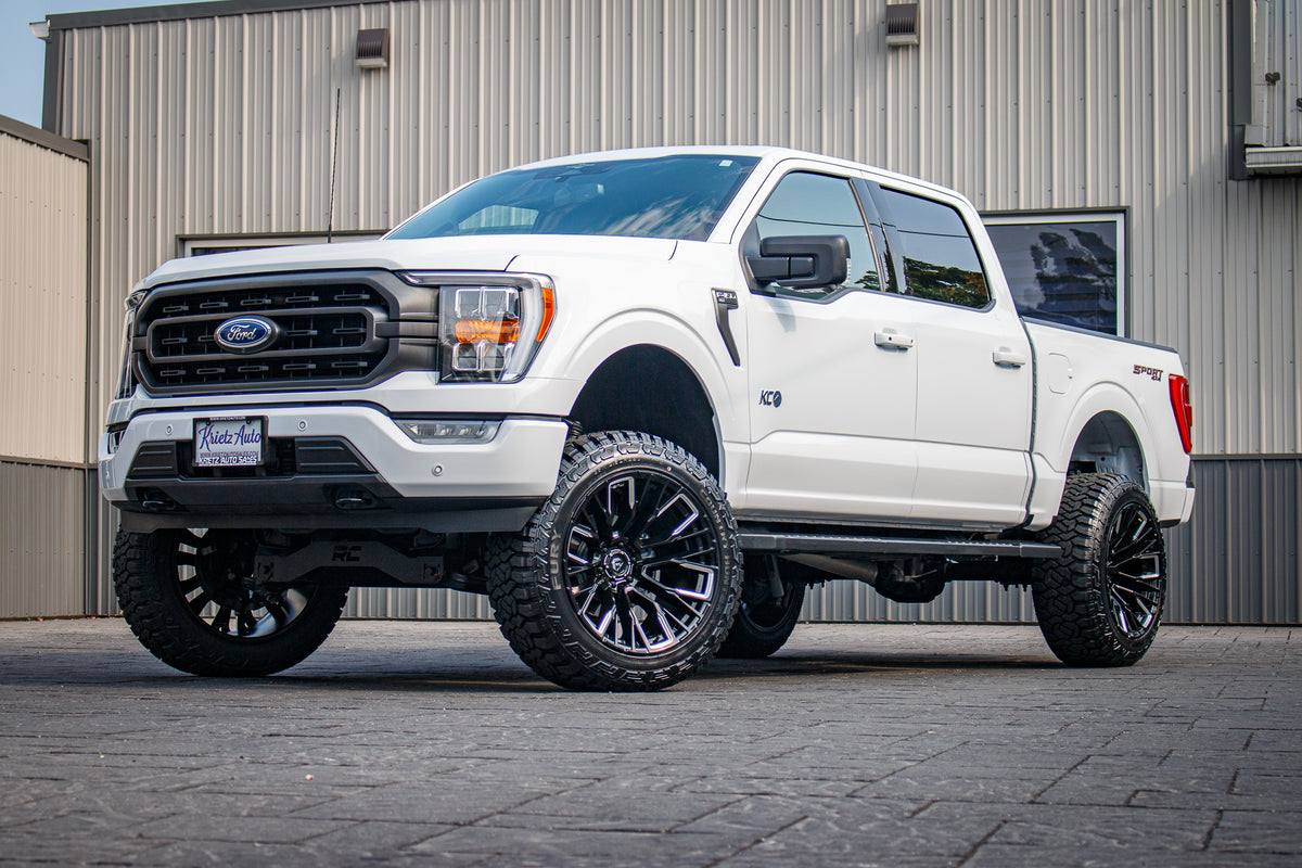 2023 Ford F-150 XLT with a 6" Rough Country lift kit, 22x12 Fuel Rebar wheels, and 35" Fury Country Hunter R/T tires.
