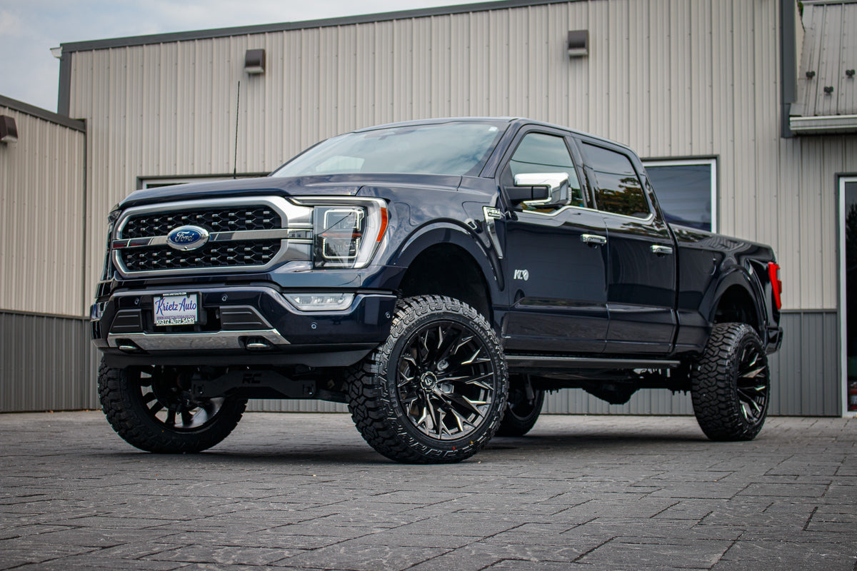 2022 Ford F-150 Platinum with a 6" Rough Country lift kit, 22x12 Fuel Flame wheels, and 35" Fury Country Hunter R/T tires.