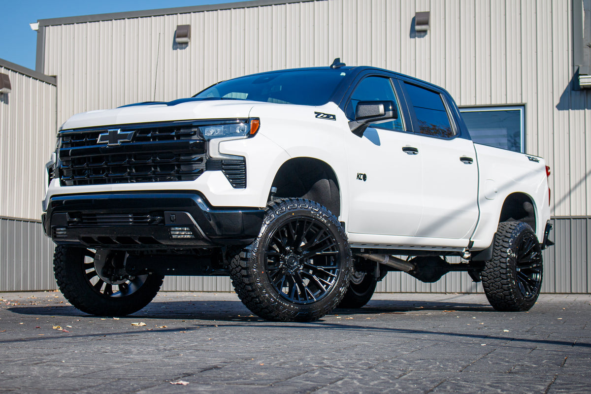 2025 Chevrolet Silverado 1500 LT Trail Boss with a 6" Rough Country lift kit, 22x12 Fuel Rebar wheels, and 35" Fury Country Hunter R/T tires.