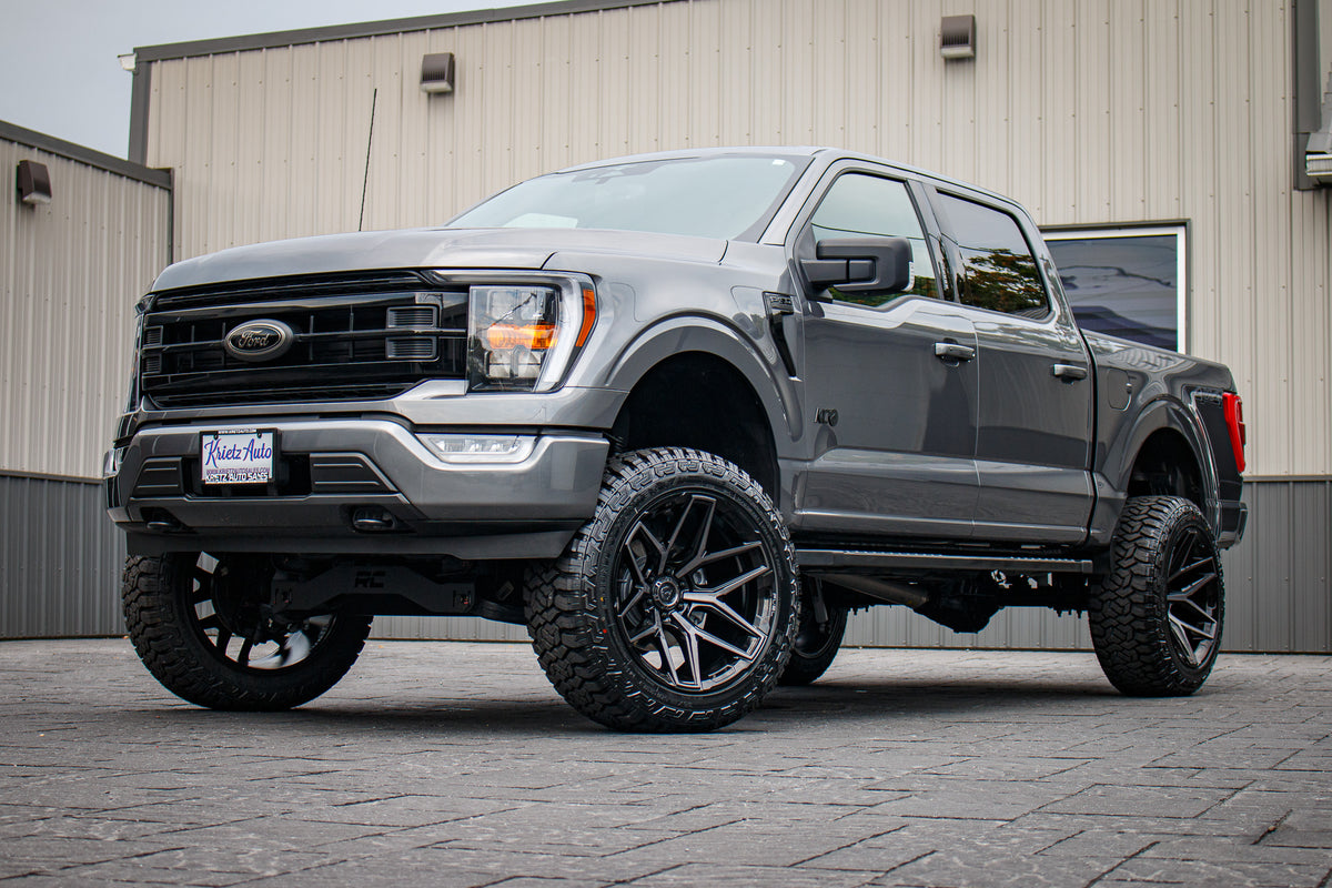 2023 Ford F-150 XLT with a 6" Rough Country lift kit, 22x12 Fuel Flux wheels, and 35" Fury Country Hunter R/T tires.