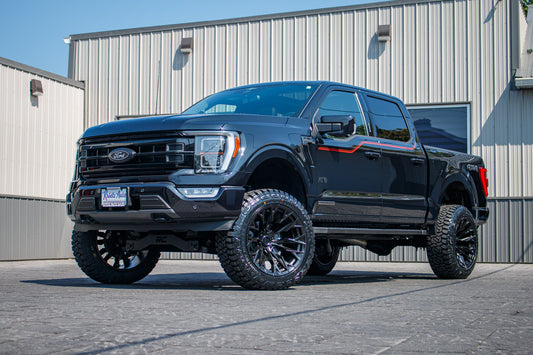 2023 Ford F-150 Lariat with a 6" Rough Country lift kit, 22x12 Fuel Flame wheels, and 35" Fury Country Hunter R/T tires.