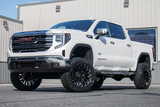 2025 GMC Sierra 1500 SLT with a 6" Rough Country lift kit, 22x12 Fuel Strike wheels, and 35" Fury Country Hunter R/T tires.