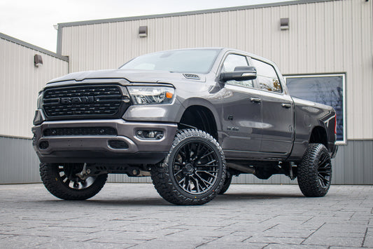 2022 Ram 1500 Big Horn with a 6" Rough Country lift kit, 22x12 Fuel Rebar wheels, and 35" Fury Country Hunter R/T tires.