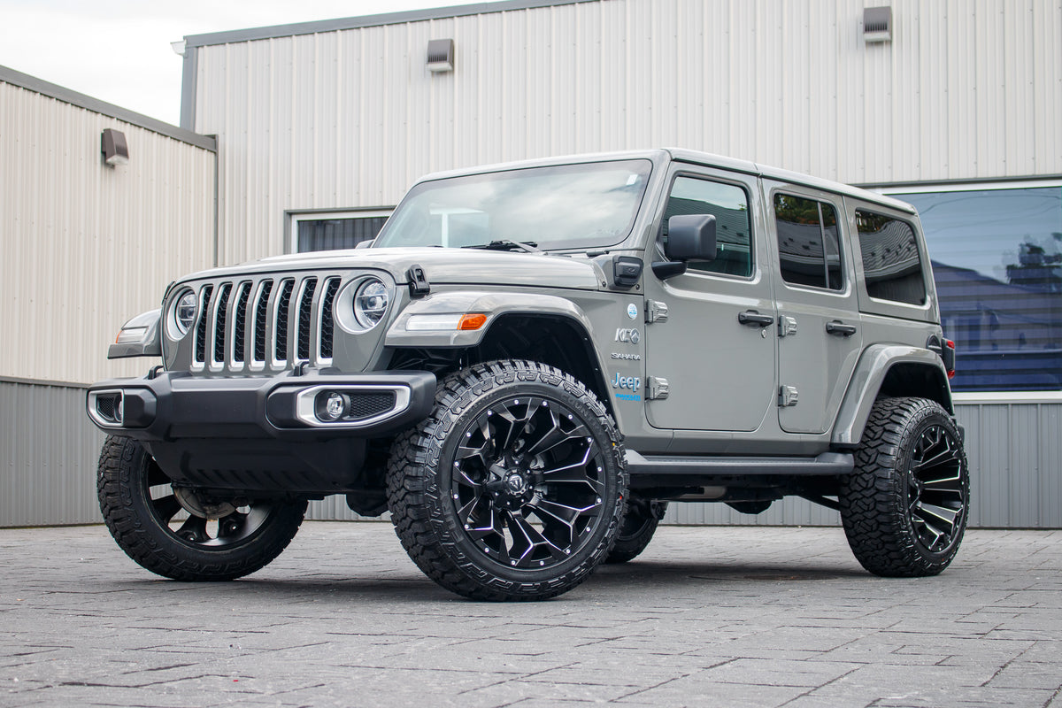 2021 Jeep Wrangler Unlimited Sahara 4XE with a 2.5" Rough Country lift kit, 22x12 Fuel Assault wheels, and 35" Fury Country Hunter R/T tires.