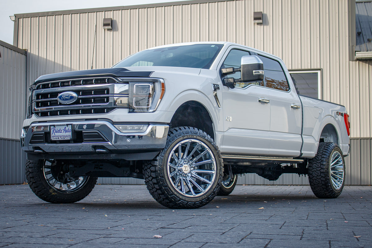 2023 Ford F-150 XLT with a 6" Rough Country lift kit, 22x12 Hostile Typhoon wheels, and 35" Fury Country Hunter R/T tires.