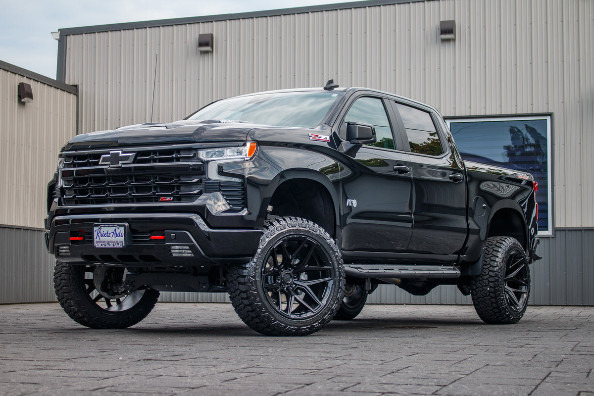 2024 Chevrolet Silverado 1500 LT Trail Boss with a 6" Rough Country lift kit, 22x12 Fuel Flux wheels, and 35" Fury Country Hunter R/T tires.