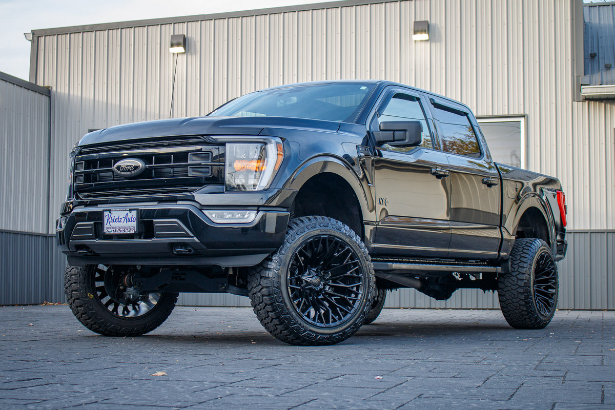 2023 Ford F-150 XLT with a 6" Rough Country lift kit, 22x12 Fuel Strike wheels, and 35" Fury Country Hunter R/T tires.