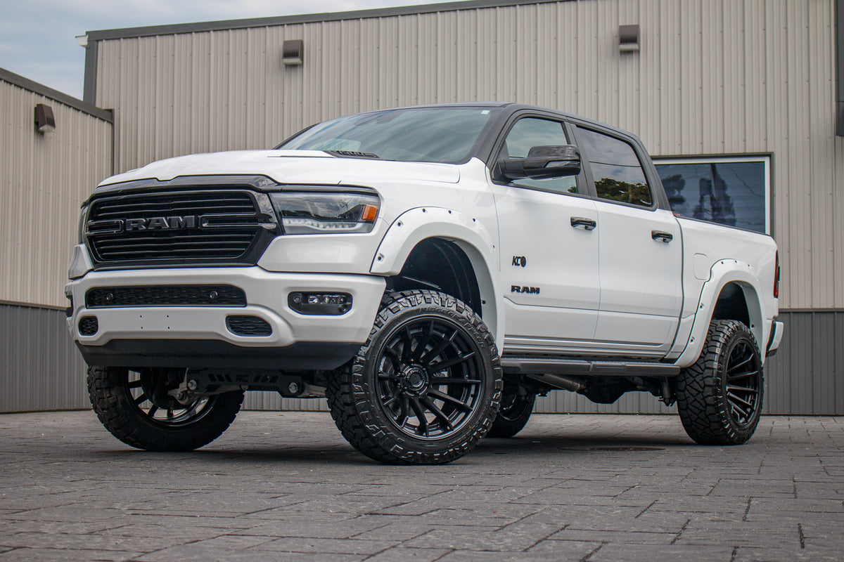 2023 Ram 1500 Laramie with a 6" Rough Country lift kit, 22x12 Fuel Burn wheels, and 35" Fury Country Hunter R/T tires.