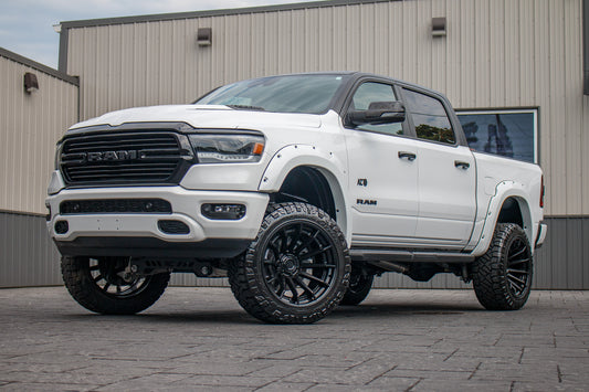 2023 Ram 1500 Laramie with a 6" Rough Country lift kit, 22x12 Fuel Burn wheels, and 35" Fury Country Hunter R/T tires.