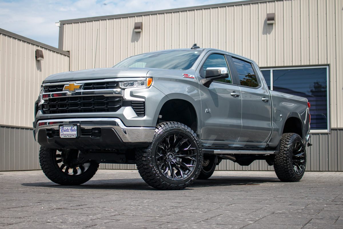 2023 Chevrolet Silverado 1500 LT with a 6" Rough Country lift kit, 22x12 Fuel Flame wheels, and 35" Fury Country Hunter R/T tires.