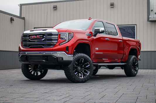 2025 GMC Sierra 1500 SLT with a 6" Rough Country lift kit, 22x12 Fuel Rebar wheels, and 35" Fury Country Hunter R/T tires.