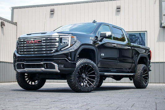 2022 GMC Sierra 1500 Denali with a 6" Rough Country lift kit, 22x12 Hostile H123 wheels, and 35" Fury Country Hunter R/T tires.