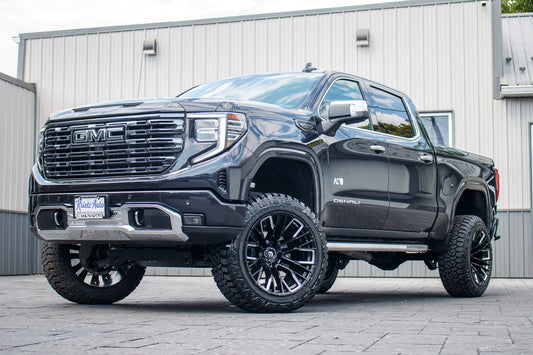 2023 GMC Sierra 1500 Denali Ultimate with a 6" Rough Country lift kit, 22x12 Fuel Rebar wheels, and 35" Fury Country Hunter R/T tires.