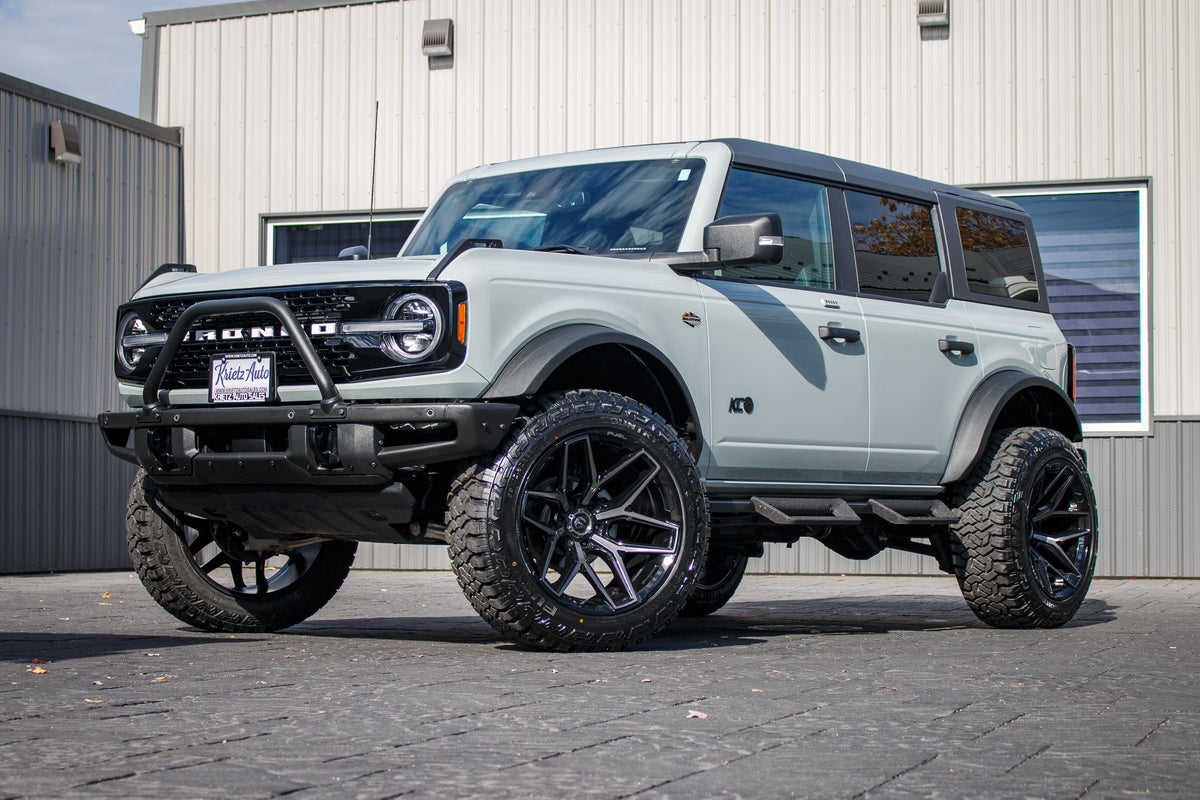 2023 Ford Bronco Wildtrak with a 2.25" Zone lift kit, 22x12 Fuel Flux wheels, and 35" Fury Country Hunter R/T tires.