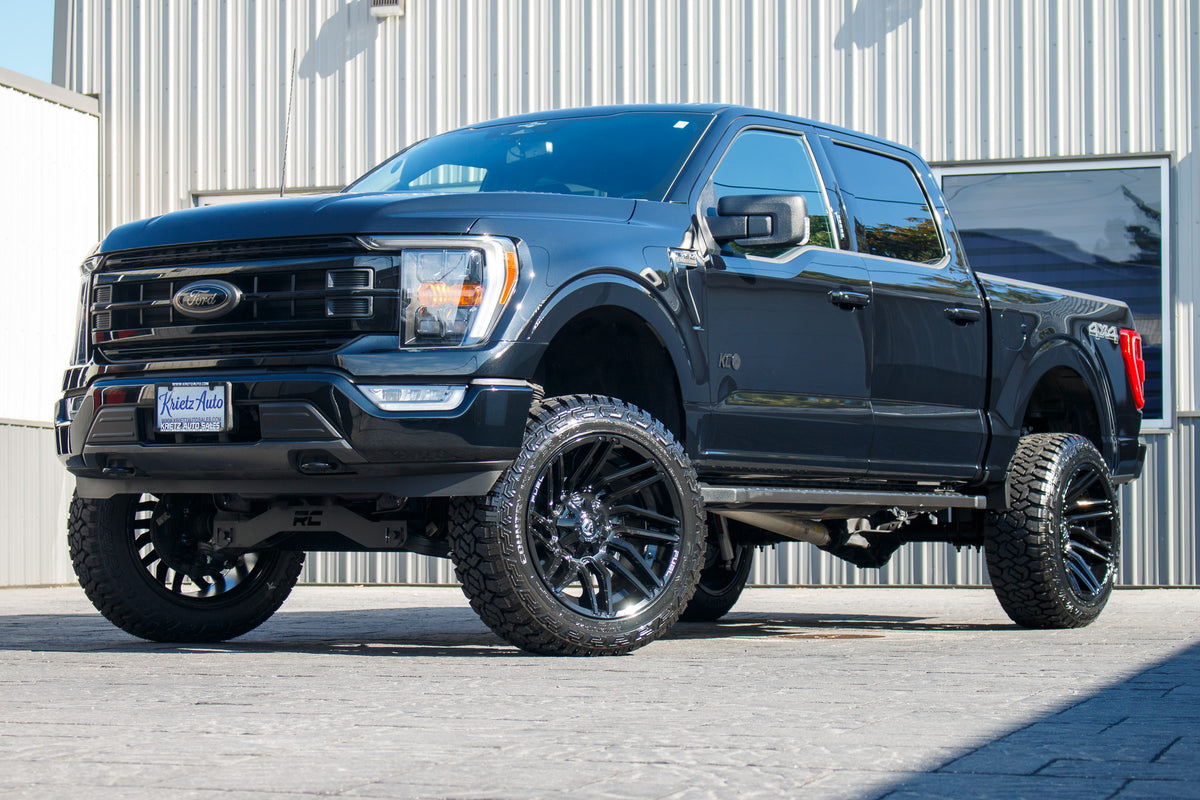 2023 Ford F-150 XLT with a 6" Rough Country lift kit, 22x12 Fuel Typhoon wheels, and 35" Fury Country Hunter R/T tires.