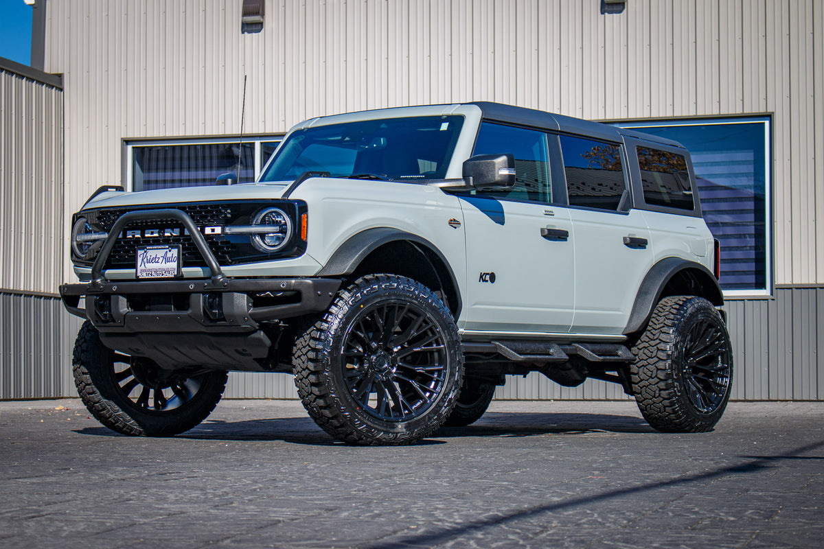 2023 Ford Bronco Wildtrak with a 2.25" Zone lift kit, 22x12 Fuel Rebar wheels, and 35" Fury Country Hunter R/T tires.