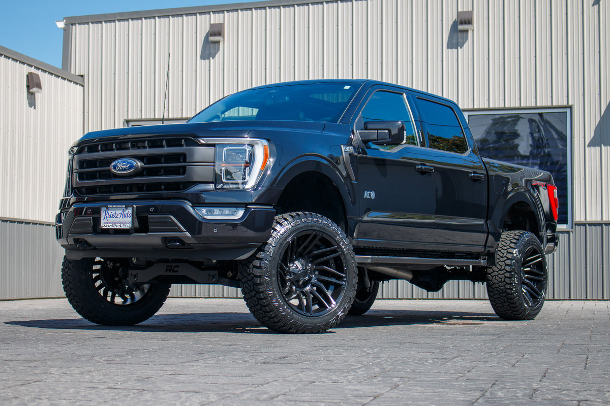 2023 Ford F-150 XLT with a 6" Rough Country lift kit, 22x12 Fuel Typhoon wheels, and 35" Fury Country Hunter R/T tires.