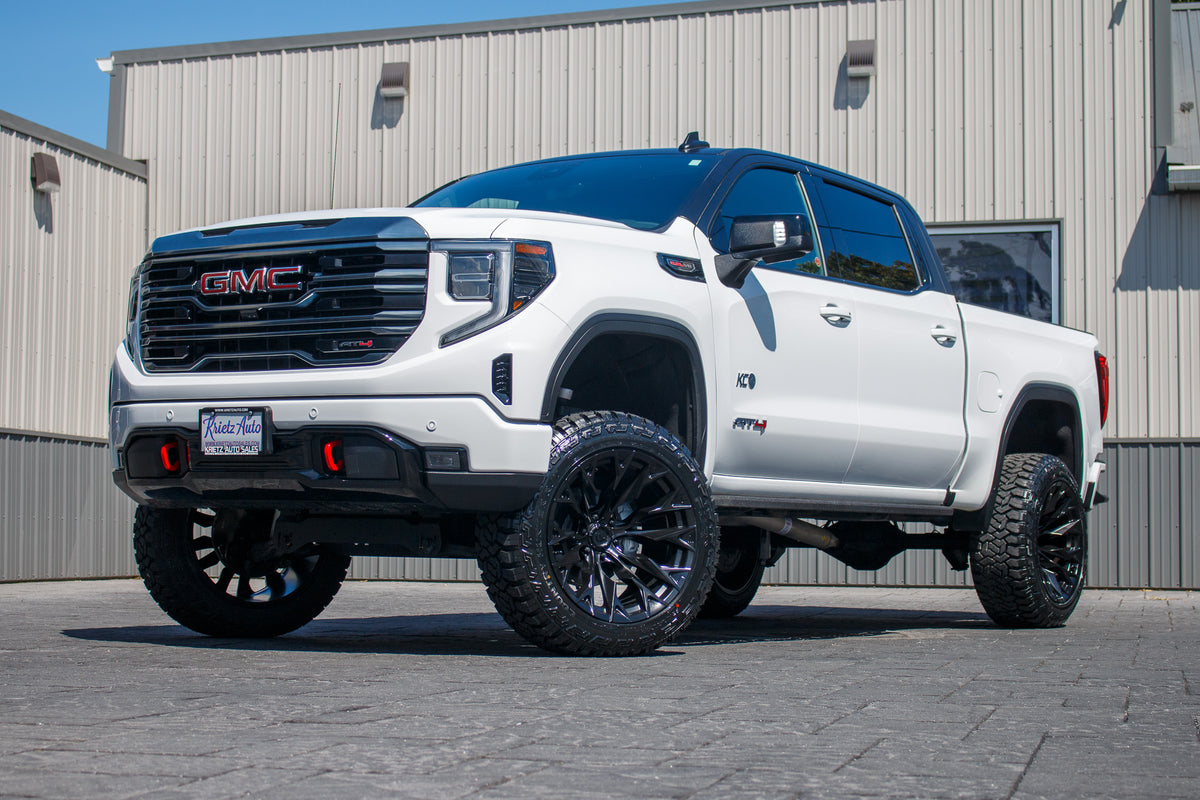 2024 GMC Sierra 1500 AT4 with a 6" Rough Country lift kit, 22x12 Fuel Flame wheels, and 35" Fury Country Hunter R/T tires.