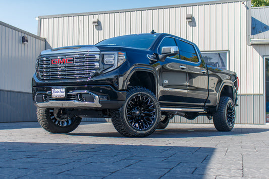 2024 GMC Sierra 1500 Denali with a 6" Rough Country suspension kit, 22x12 Fuel Strike wheels, and 35" Fury Country Hunter R/T tires.