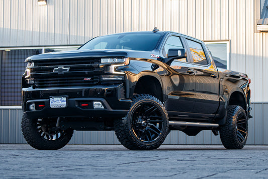 2022 Chevrolet Silverado 1500 LT Trail Boss with a 6" Rough Country lift kit, 22x12 Fuel Typhoon wheels, and 35" Fury Country Hunter R/T tires.