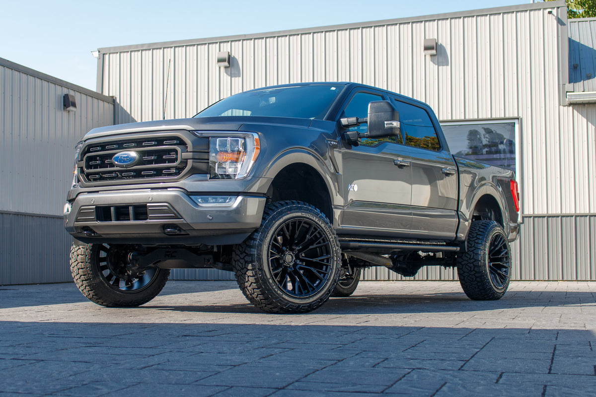 2023 Ford F-150 XLT with a 6" Rough Country lift kit, 22x12 Fuel Rebar wheels, and 35" Fury Country Hunter R/T tires.