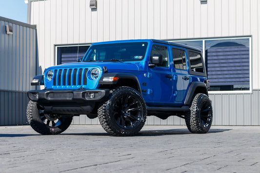 2021 Jeep Wrangler Unlimited Sport with a 2.5" Rough Country lift kit, 22x12 Fuel Flame wheels, and 35" Fury Country Hunter R/T tires.