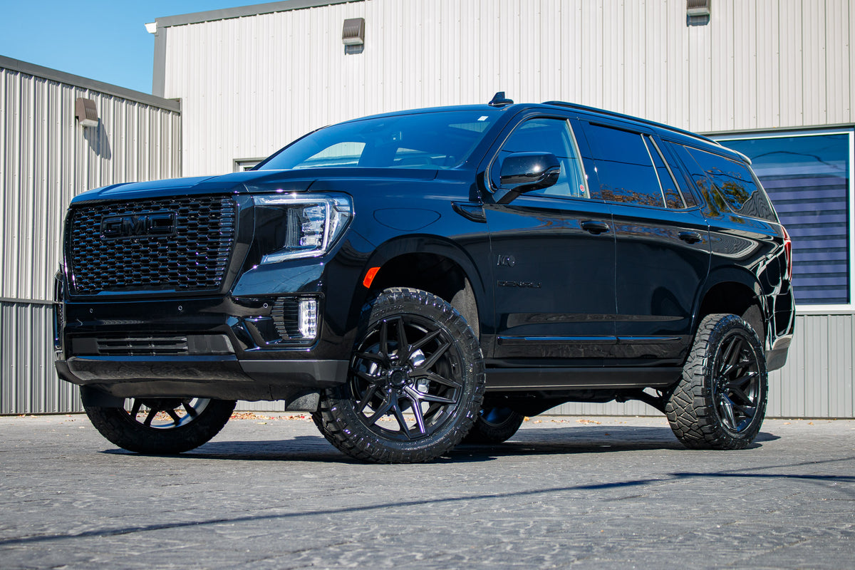 2024 GMC Yukon Denali with a 3" ReadyLift lift kit, 22x10 Fuel Flux wheels, and 295/50 Nitto Ridge Grappler tires.