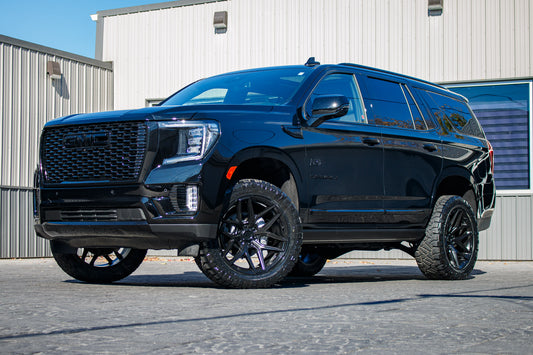 2024 GMC Yukon Denali with a 3" ReadyLift lift kit, 22x10 Fuel Flux wheels, and 295/50 Nitto Ridge Grappler tires.