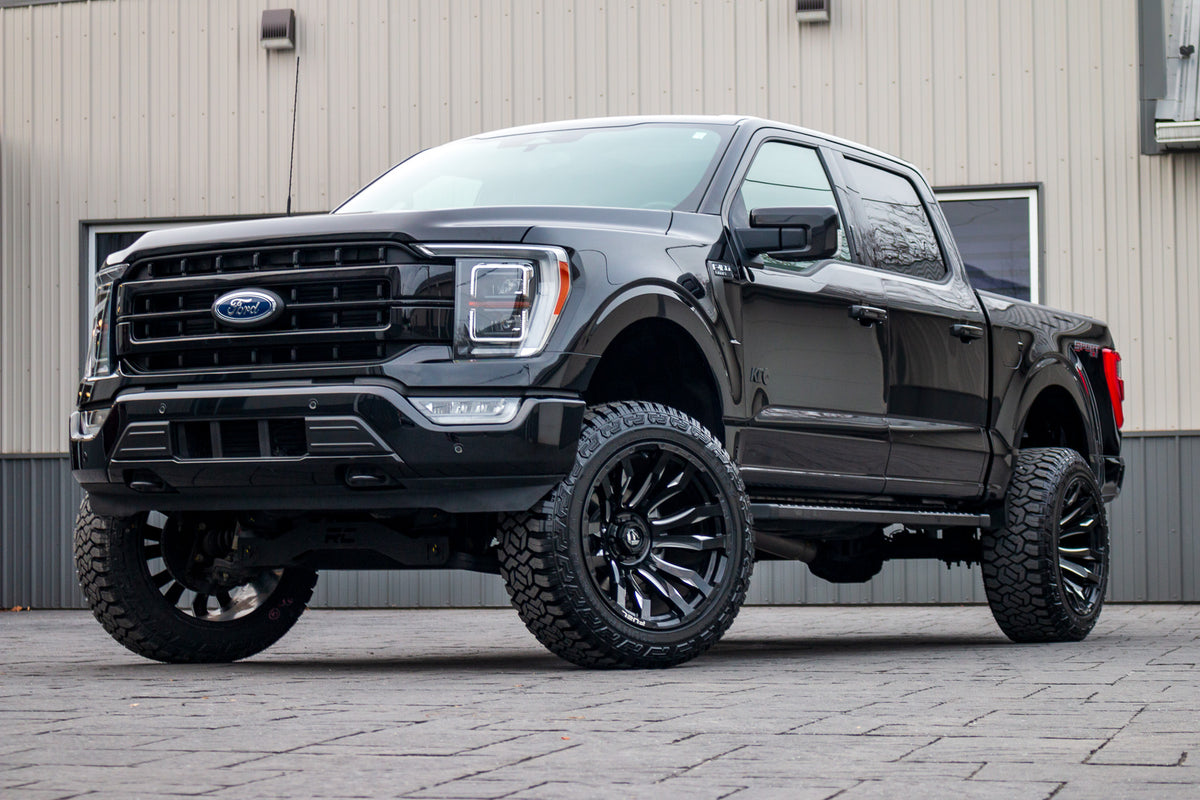 2022 Ford F-150 Lariat with a 6" Rough Country lift kit, 22x12 Fuel Blitz wheels, and 35" Fury Country Hunter R/T tires.
