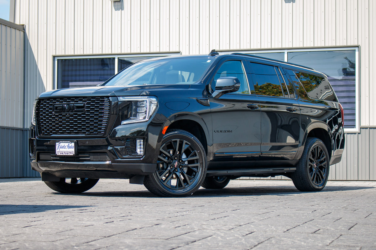 2023 GMC Yukon XL SLT with GMC Factory suspension, 22x9 GMC Stock wheels, and Bridgestone Alenza tires.