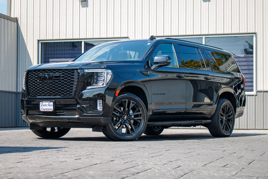 2023 GMC Yukon XL SLT with GMC Factory suspension, 22x9 GMC Stock wheels, and Bridgestone Alenza tires.