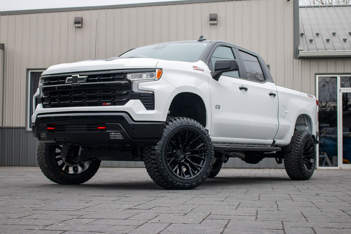 2024 Chevrolet Silverado 1500 LT Trail Boss with a 6" Rough Country lift kit, 22x12 Fuel Rebar wheels, and 35" Fury Country Hunter R/T tires.